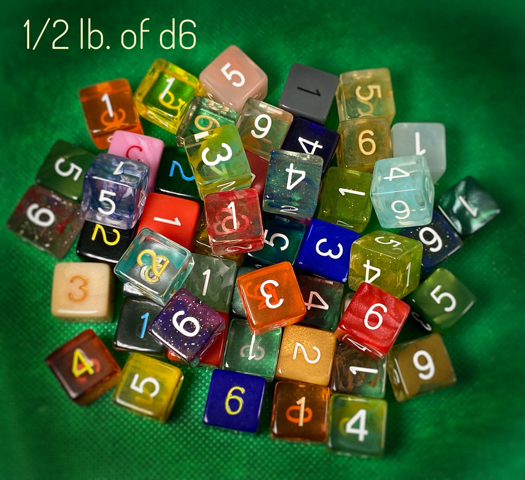 Image of 1/2 pound of numbered d6s, in various colors and styles across all of our product lines, but they may also include unreleased factory prototypes or discontinued colors. This selection includes roughly 50 dice by weight.